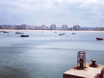 Boats in sea against sky