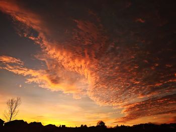Low angle view of dramatic sky during sunset