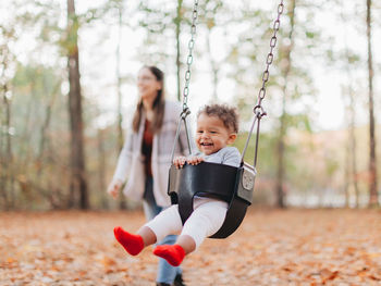 Siblings playing in park