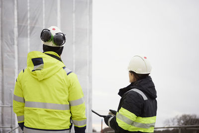 Engineers talking at building site