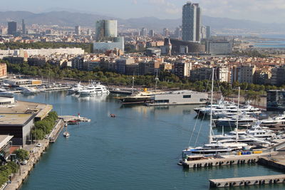 High angle view of harbor and buildings in city