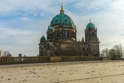 Low angle view of cathedral against cloudy sky