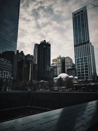 Modern buildings in city against sky