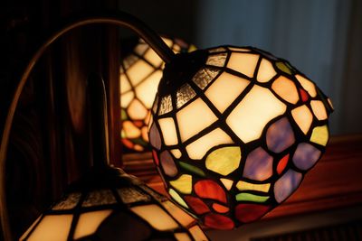 Close-up of illuminated lamp shade at home
