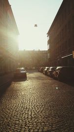 View of city street at sunset