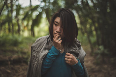 Close-up of young woman in forest