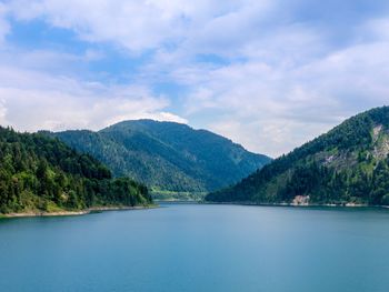 Scenic view of lake and mountains against sky