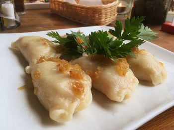 Close-up of dumplings in plate on table