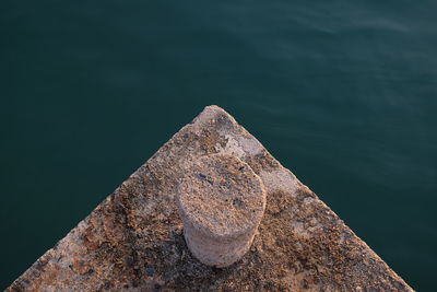 Close-up of rock by sea