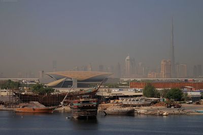 Boats moored in city