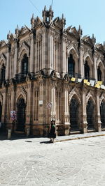 Full length of woman walking in historic building