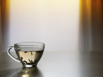 Close-up of tea in glass on table