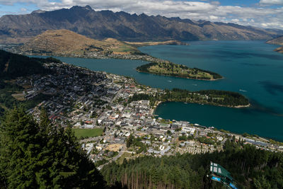 High angle view of city by sea