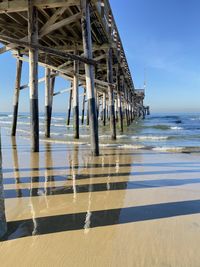 Pier over sea against sky