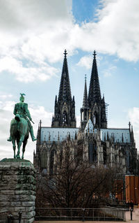 Low angle view of statue against building