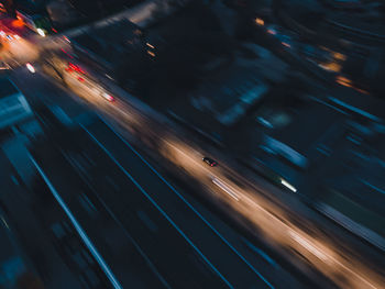 High angle view of light trails on road at night