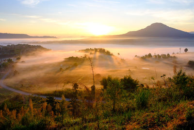 Scenic view of landscape against sky during sunset