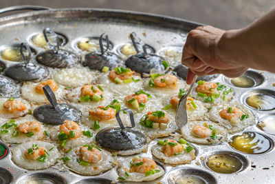 Midsection of person preparing food