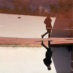 High angle view of man standing on road against sky