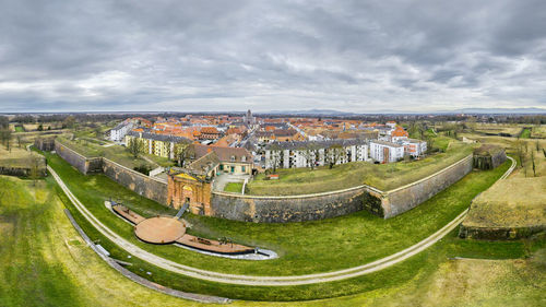 High angle view of old buildings against sky in city