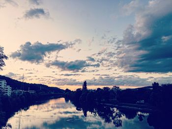 Scenic view of lake against sky during sunset