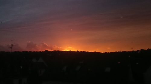 Silhouette landscape against sky during sunset