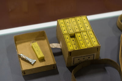 High angle view of cardboard box with tube