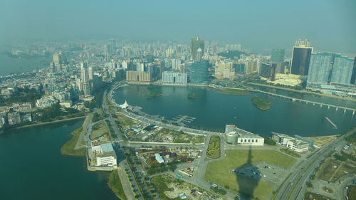 High angle view of bridge over river amidst buildings in city