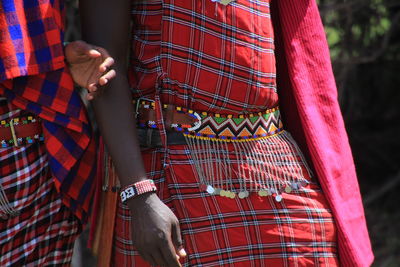 Midsection of woman standing in forest