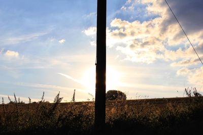 Scenic view of field against sky during sunset
