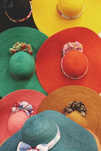 High angle view of colorful hats for sale at market