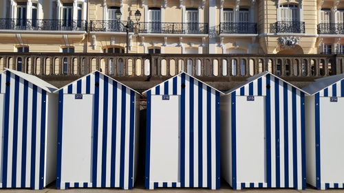 Beach cabins against in city