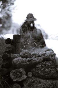 Sculpture on rock against sky