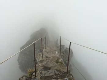 High angle view of bridge over sea in foggy weather