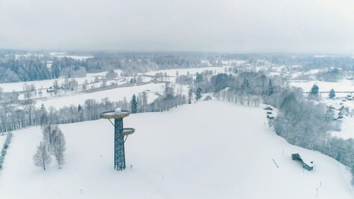 Aerial view of snow covered land and mountains