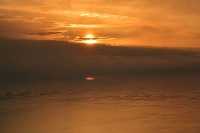 Scenic view of sea against romantic sky at sunset