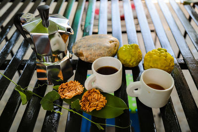 High angle view of thai snack and coffee on table