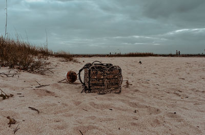 Garbage on beach against sky