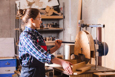 Side view of woman working