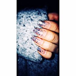 Close-up of hand holding cigarette