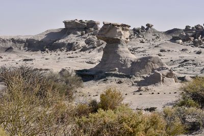 Rock formations on landscape against clear sky