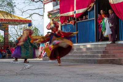 Group of people dancing at music concert