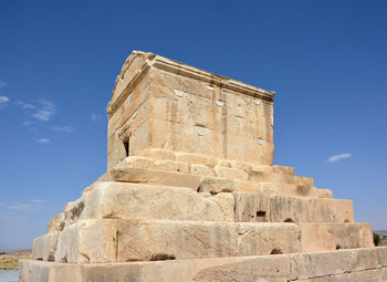 Low angle view of historical building against blue sky