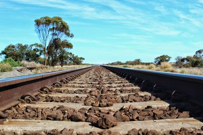 Surface level of railroad track against sky