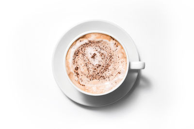 Directly above shot of coffee cup against white background