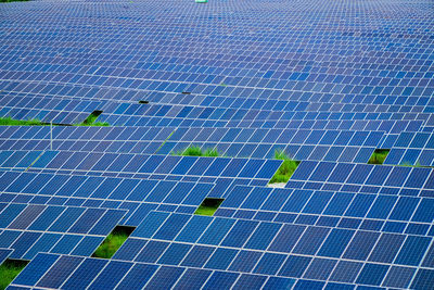 Many photovoltaic solar panels background at a solar farm