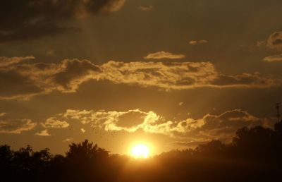 Sun shining through clouds