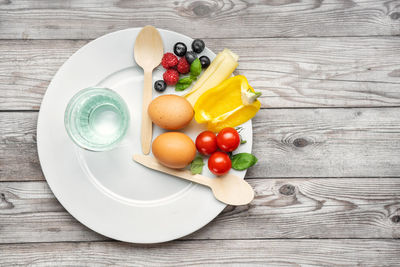 High angle view of fruits in plate on table