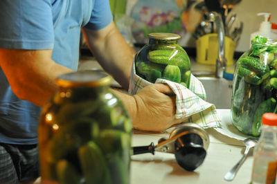 Midsection of man preparing food on table