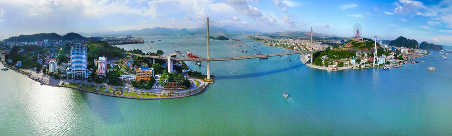 High angle view of boats moored in sea against sky